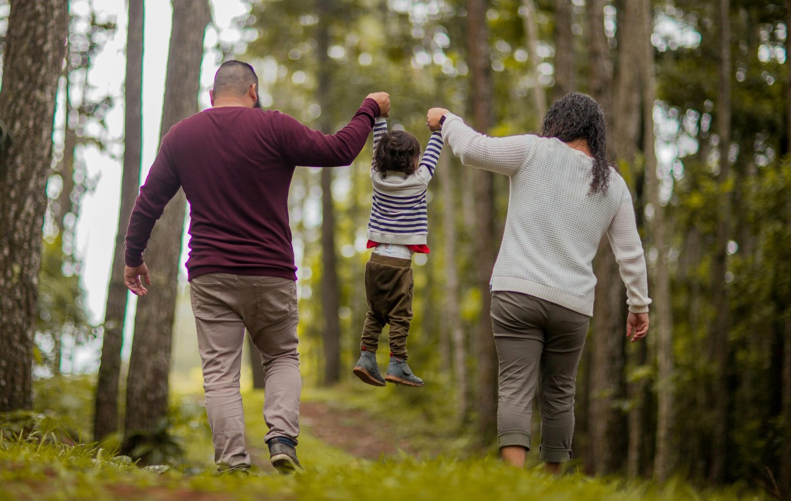 A mother, father, and child
