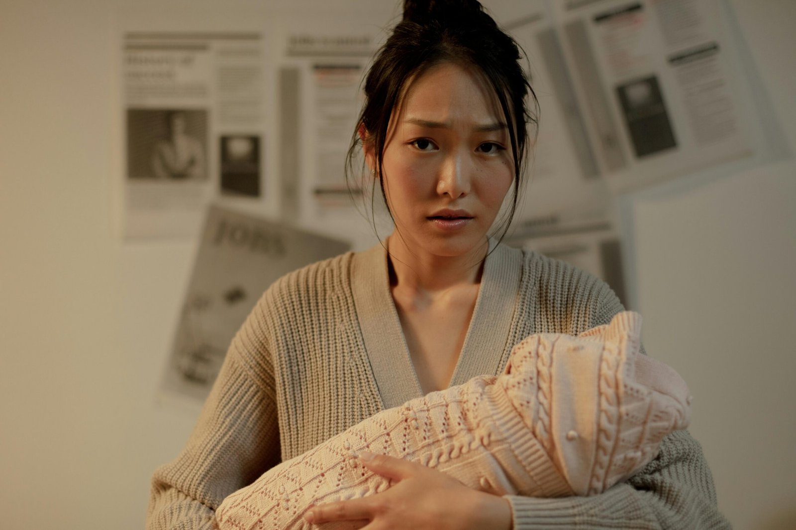 A postpartum mother holding her newborn